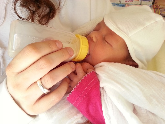 Baby being bottle fed